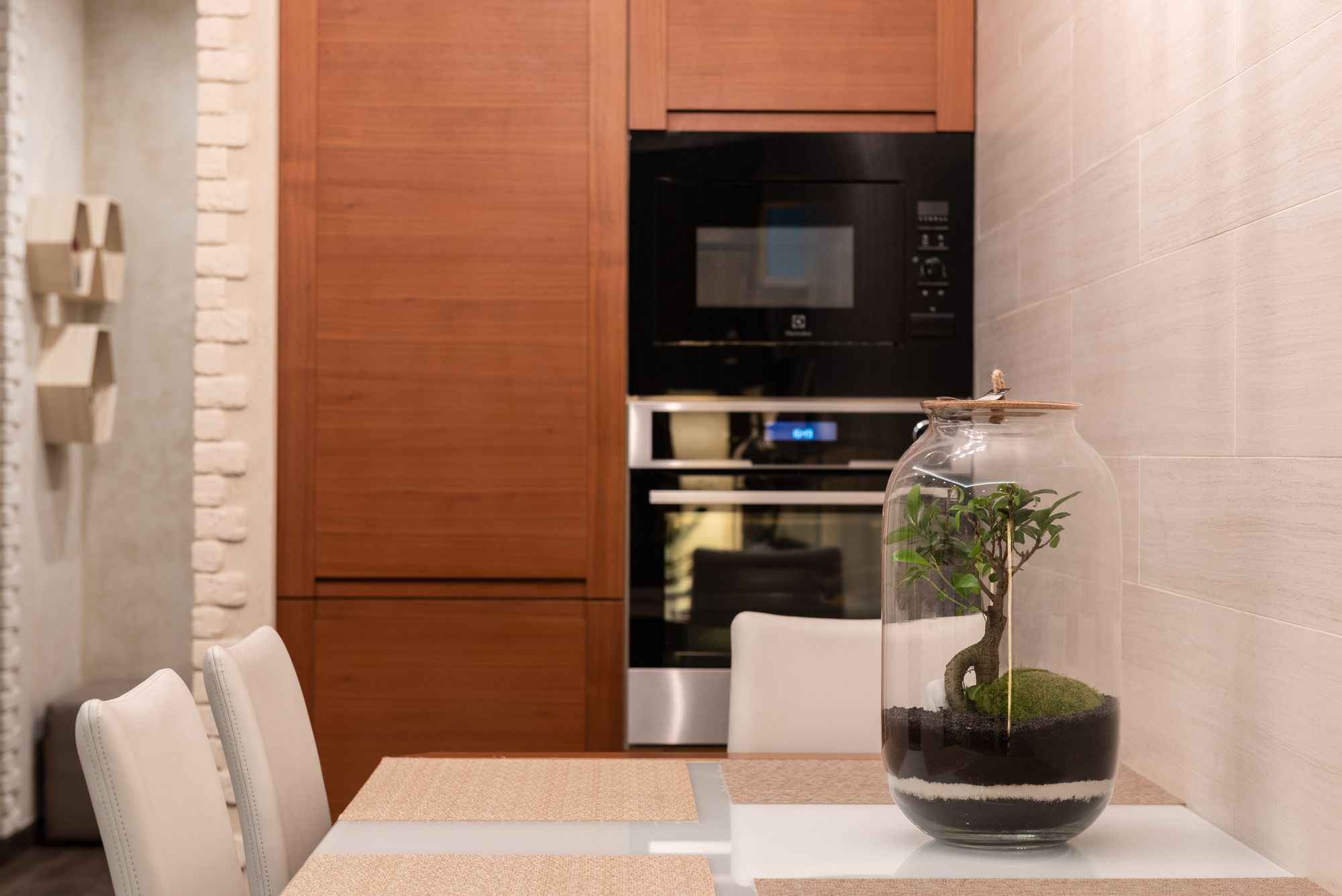 Large jar terrarium on a modern kitchen table