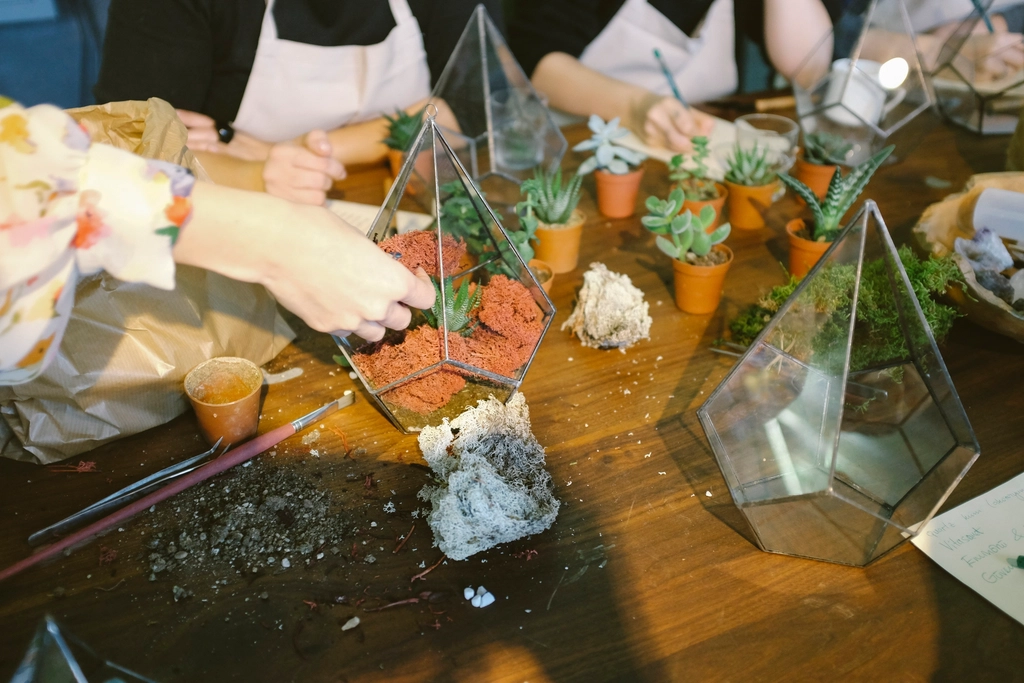 Building a terrarium by hand at a workbench